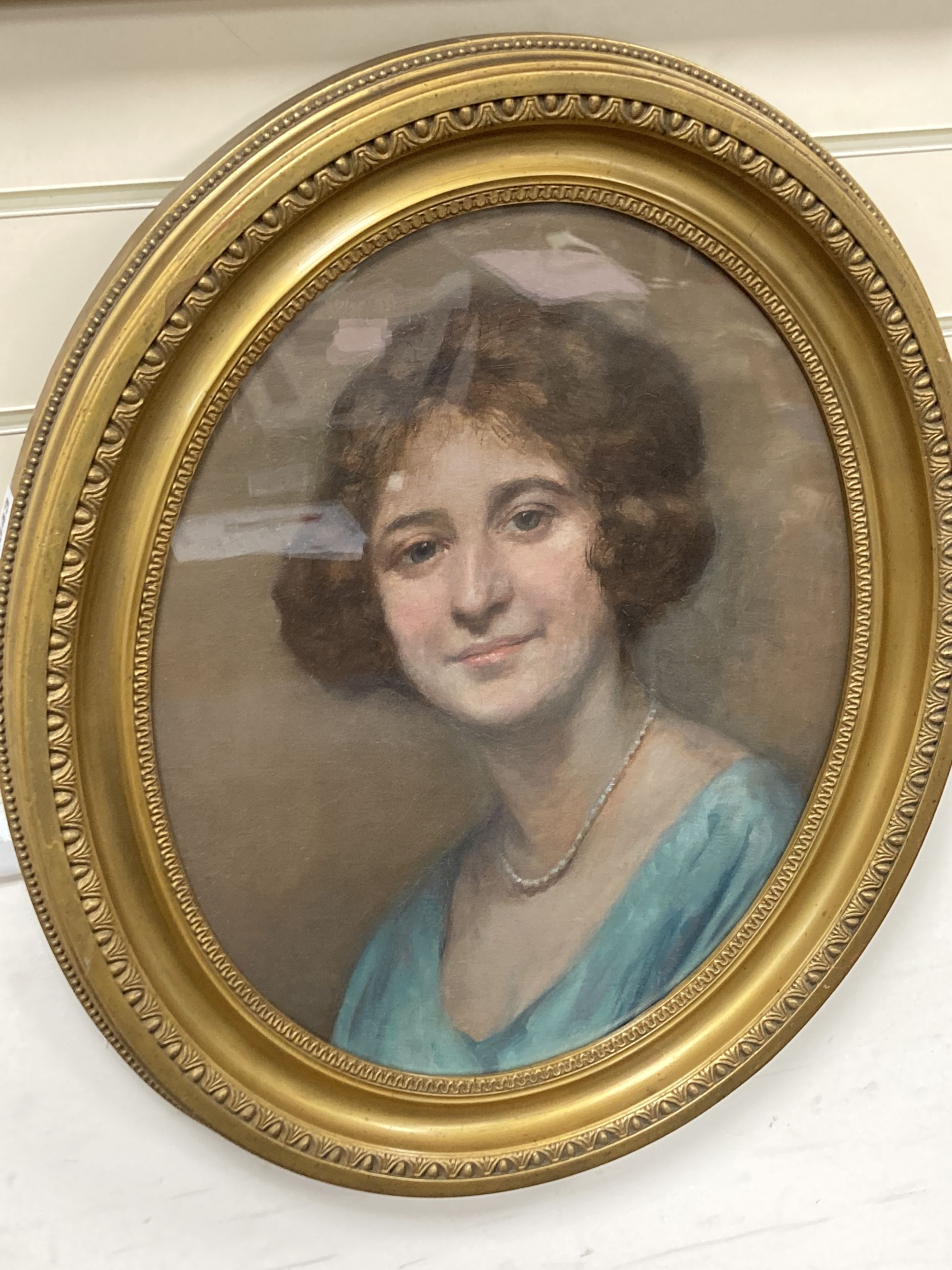 Early 20th century English School, oil on card, Portrait of a lady wearing a pearl necklace, 50 x 39cm